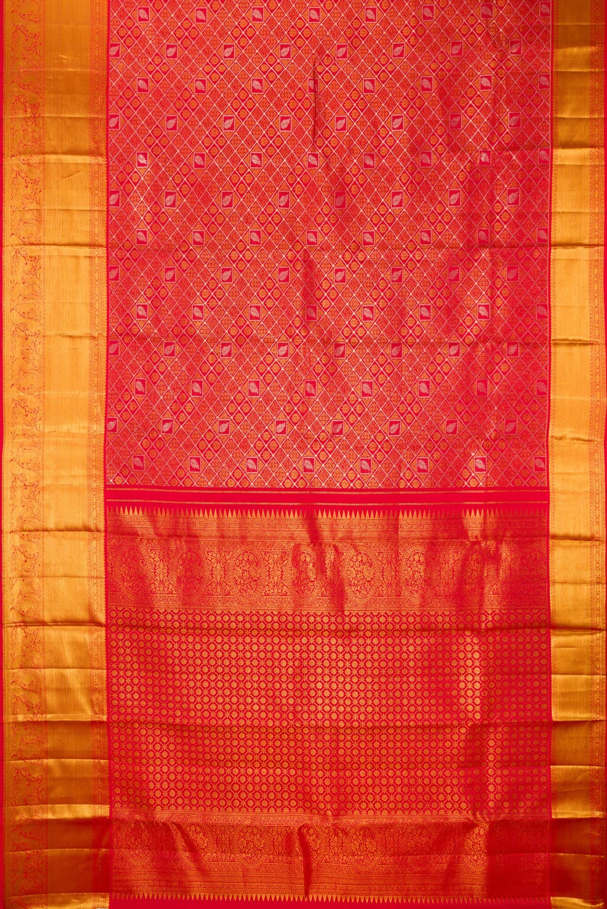 Flat view of Pure Silk Red Dual Tone Kanjivaram Saree with Zari Brocade on the body and Zari Border. 