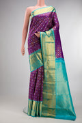 Pure Silk Purple Kanjivaram Saree with Zari Brocade on the body and Zari Border.  displayed on a mannequin