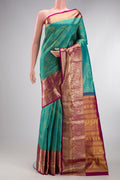 Sea Green Kanjivaram Silk Saree with Zari Brocade on the body and Fancy Border.  displayed on a mannequin