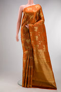 Rust Kanchipuram Silk Saree with Zari Brocade on the body and Without Border.  displayed on a mannequin