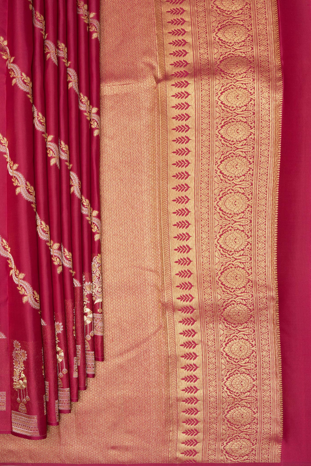 Pleats and pallu of Pure Silk Maroon Kanchipuram Saree with Zari Butta on the body and Fancy Border. 