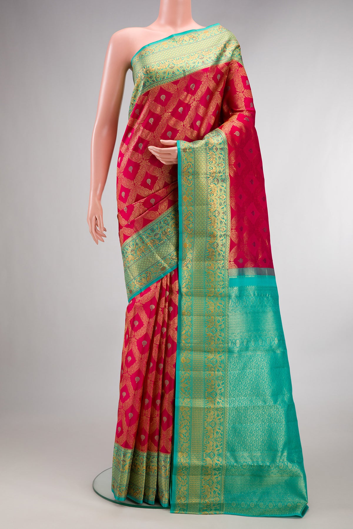 Pure Silk Dark Pink Dual Tone Kanjivaram Saree with Zari Brocade on the body and Zari Border.  displayed on a mannequin