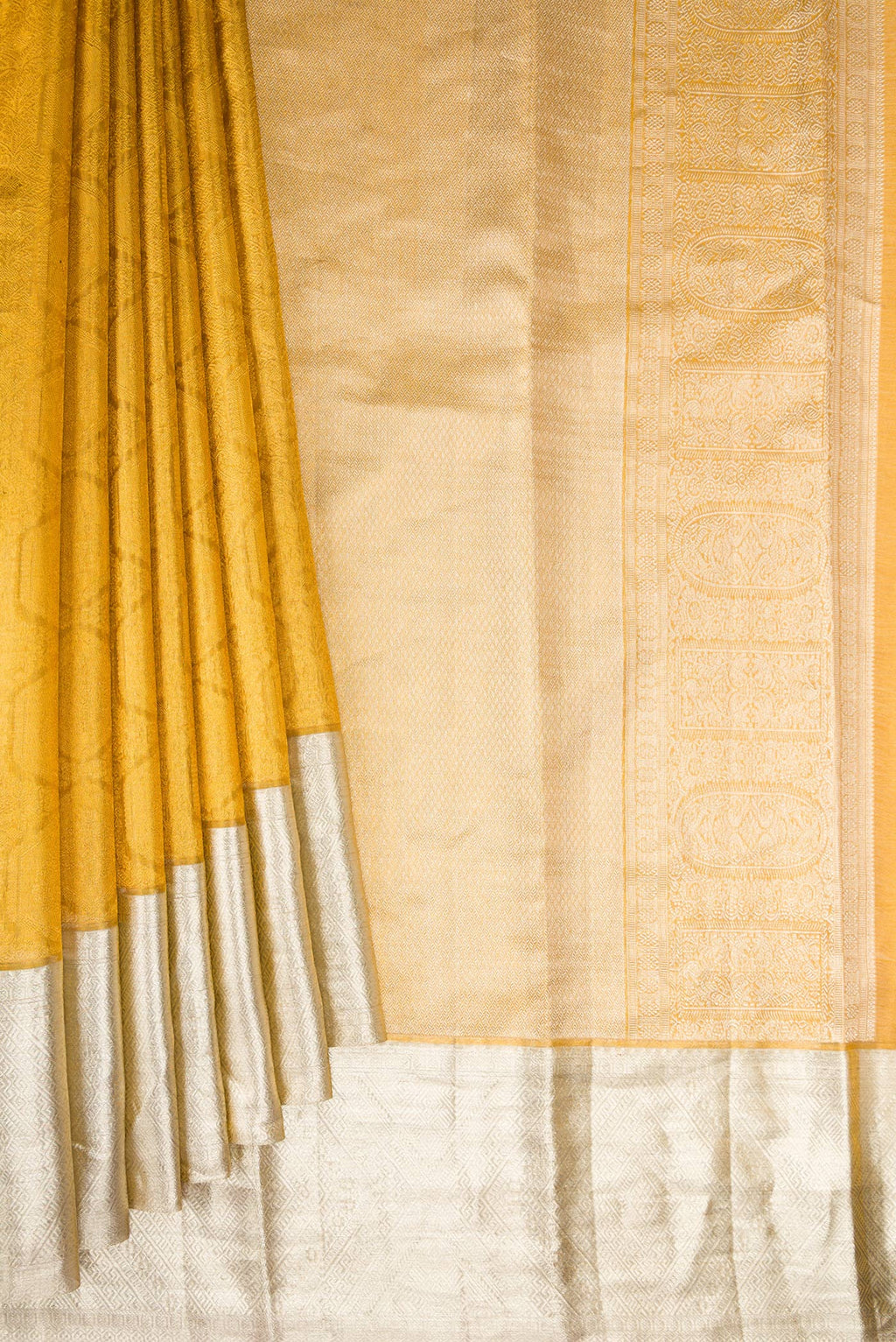 Pleats and pallu of Sandal Dual Tone Kanjivaram Tissue Saree with Zari Brocade on the body and Zari Border. 