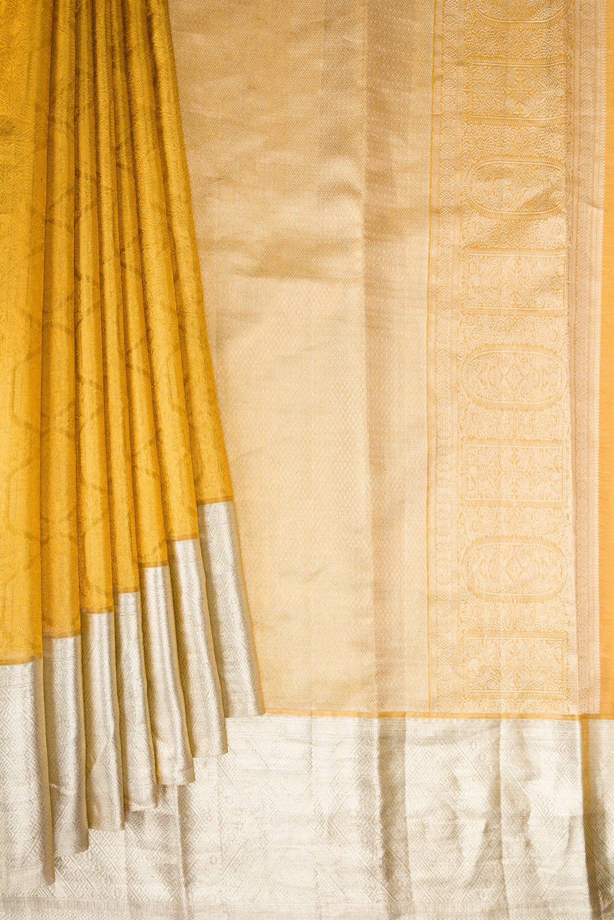 Pleats and pallu of Sandal Dual Tone Kanjivaram Tissue Saree with Zari Brocade on the body and Zari Border. 