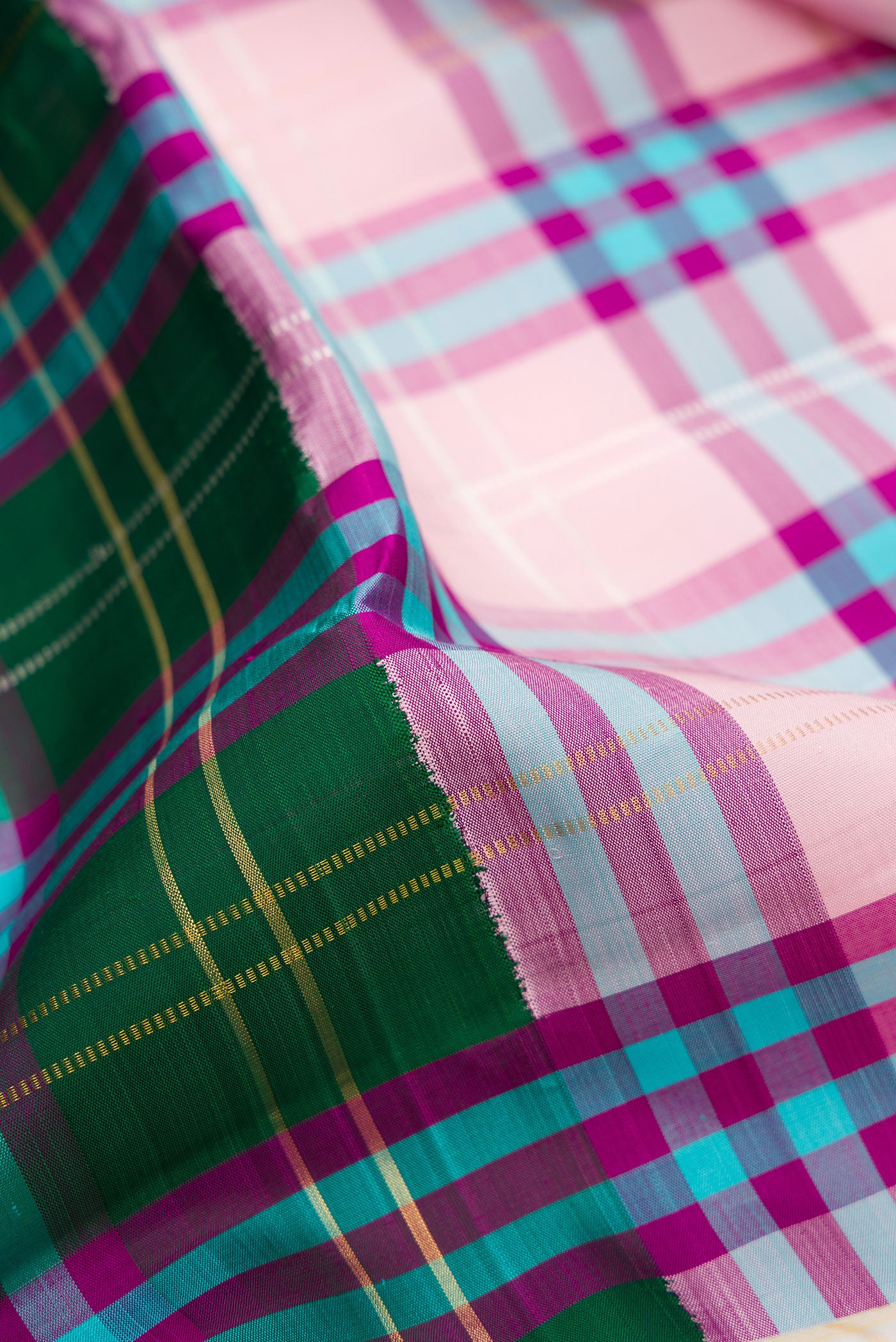 Close up of Multi Color Kanjivaram Silk Saree with Half And Half on the body and Without Border.  displaying folds