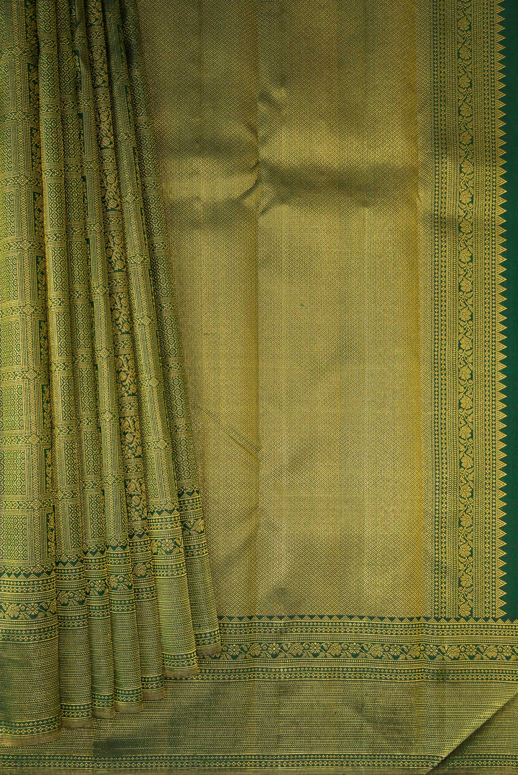 Pleats and pallu of Bottle Green Kanchipuram Silk Saree with Zari Brocade on the body and Fancy Border. 