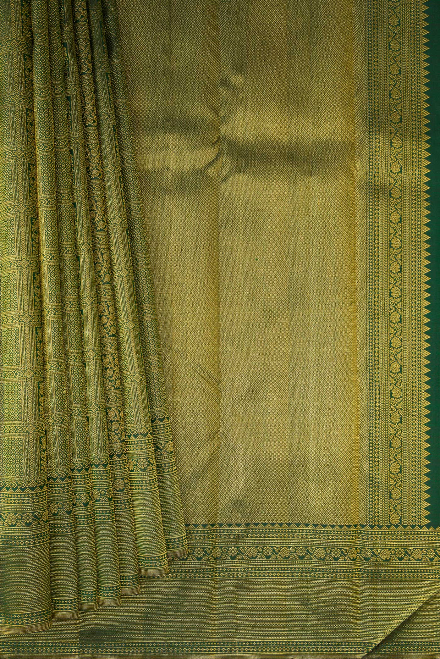 Pleats and pallu of Bottle Green Kanchipuram Silk Saree with Zari Brocade on the body and Fancy Border. 