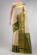 Sandal Kanchipuram Silk Saree with Checked design on the body and Zari Border.  displayed on a mannequin