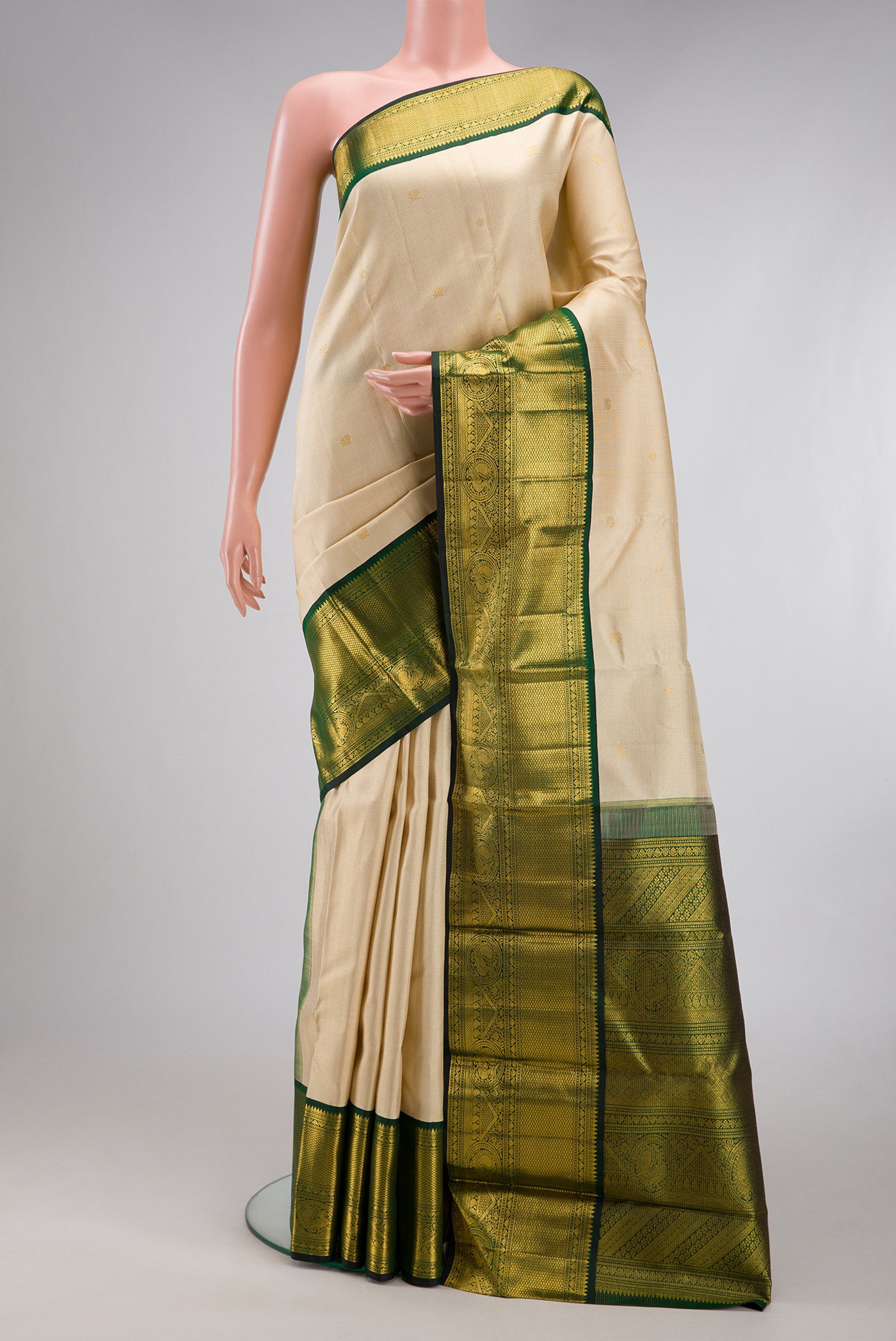 Sandal Kanchipuram Silk Saree with Checked design on the body and Zari Border.  displayed on a mannequin