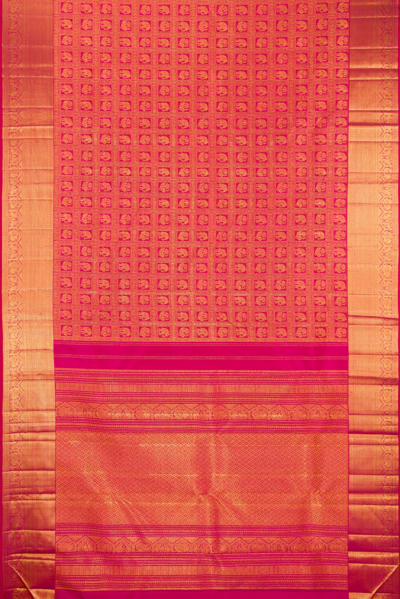 Flat view of Rani Pink Kanchipuram Silk Saree with Zari Brocade on the body and Zari Border. 