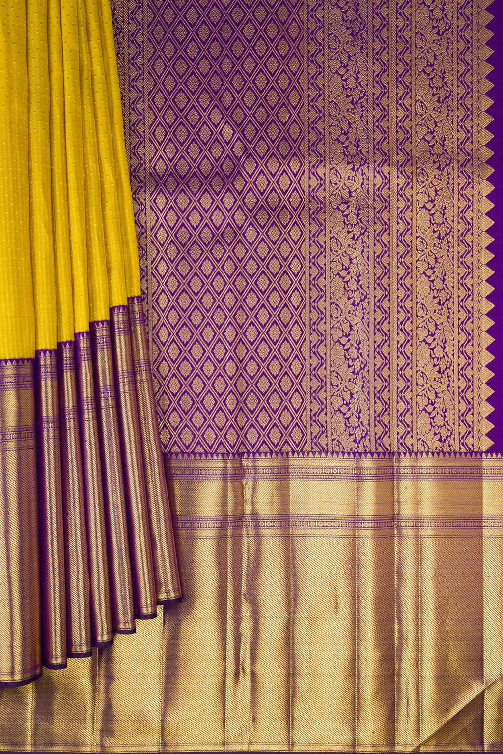 Pleats and pallu of Yellow Kanchipuram Silk Saree with Zari Butta on the body and Fancy Border. 