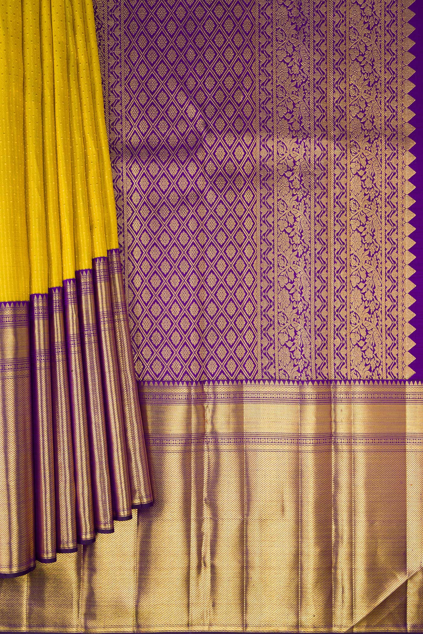 Pleats and pallu of Yellow Kanchipuram Silk Saree with Zari Butta on the body and Fancy Border. 