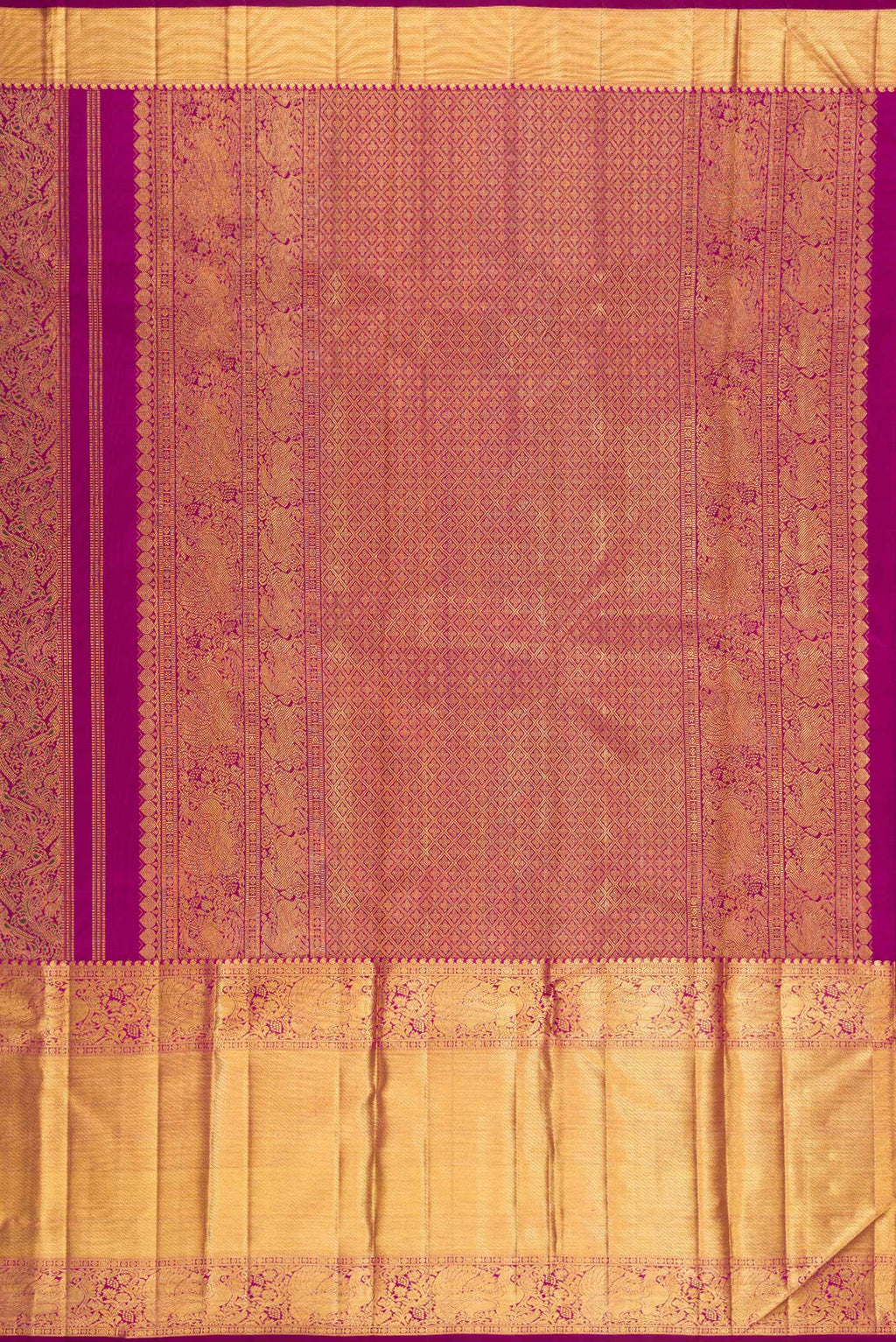 Close up image of the pallu of Magenta Kanchipuram Silk Saree with Zari Brocade on the body and Zari Border. 