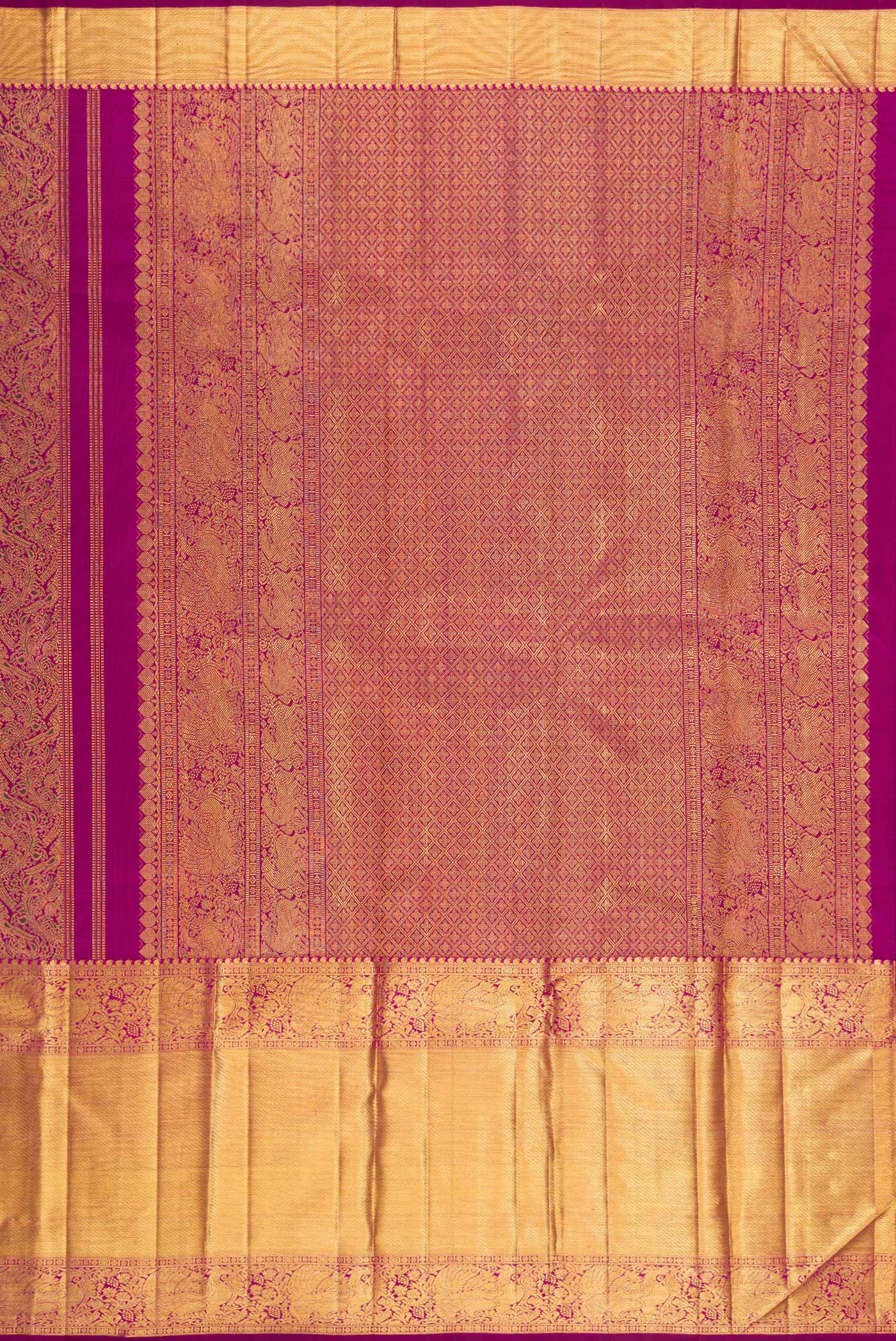 Close up image of the pallu of Magenta Kanchipuram Silk Saree with Zari Brocade on the body and Zari Border. 