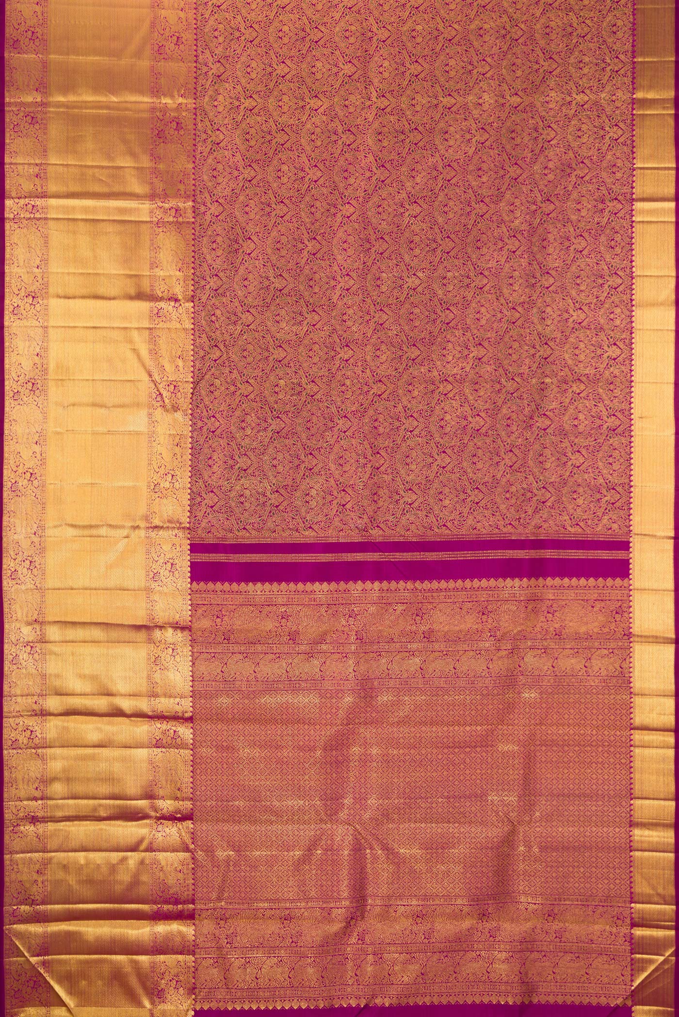 Flat view of Magenta Kanchipuram Silk Saree with Zari Brocade on the body and Zari Border. 