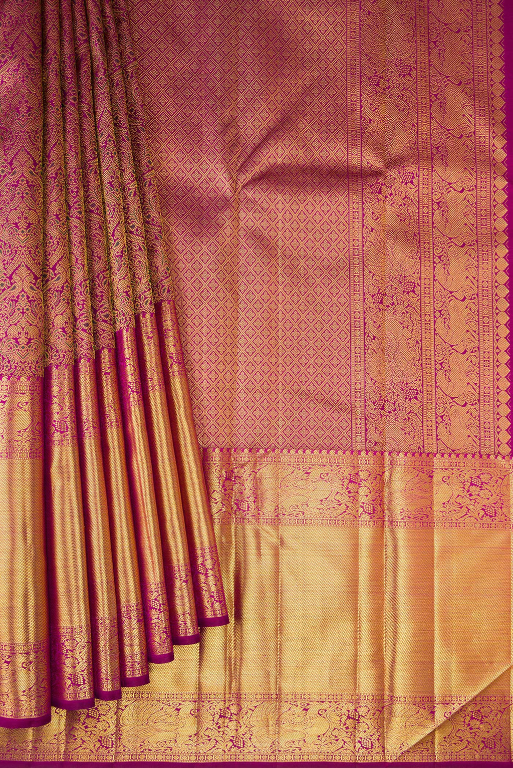 Pleats and pallu of Magenta Kanchipuram Silk Saree with Zari Brocade on the body and Zari Border. 