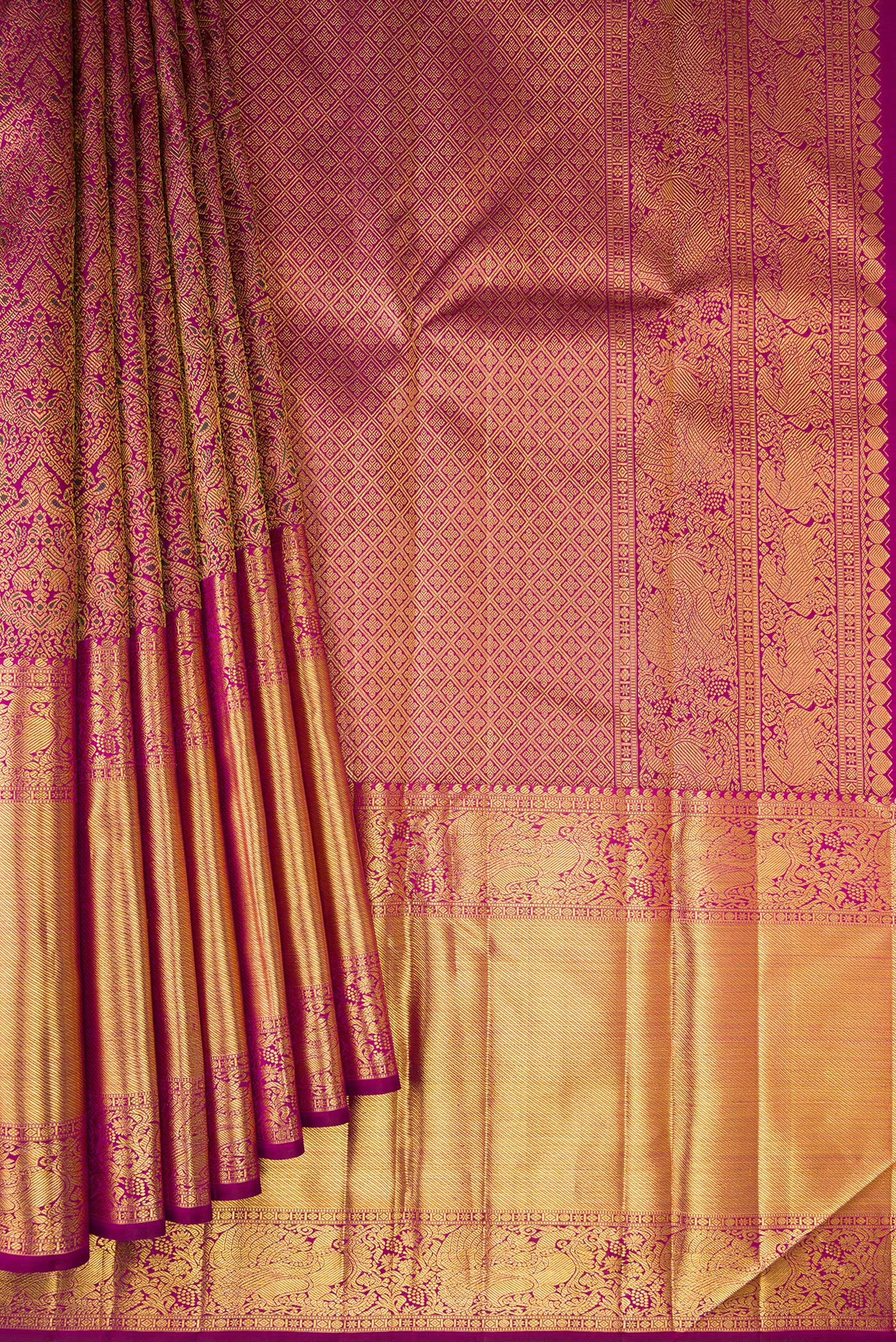 Pleats and pallu of Magenta Kanchipuram Silk Saree with Zari Brocade on the body and Zari Border. 