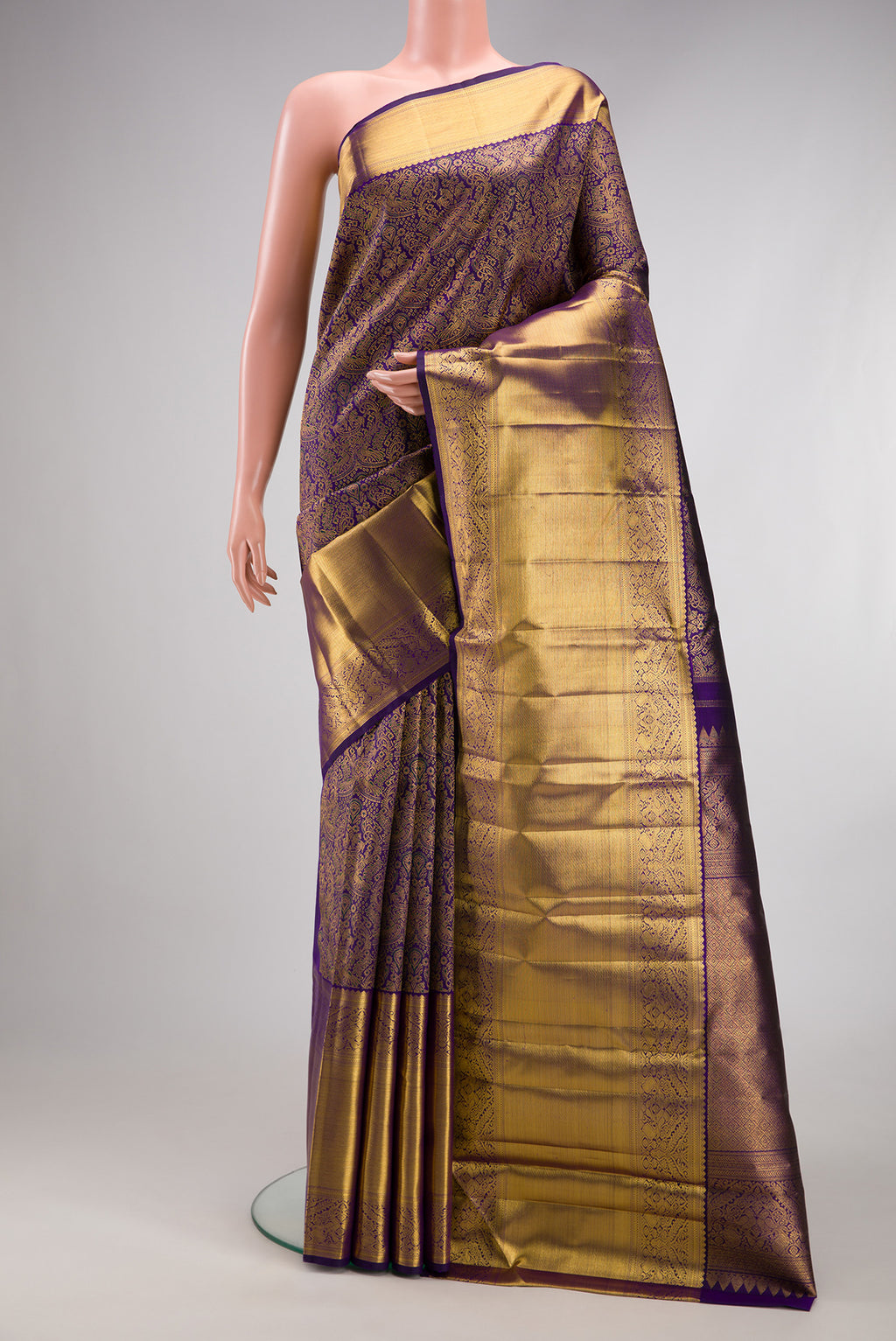 Navy Blue Dual Tone Kanchipuram Silk Saree with Zari Brocade on the body and Fancy Border.  displayed on a mannequin