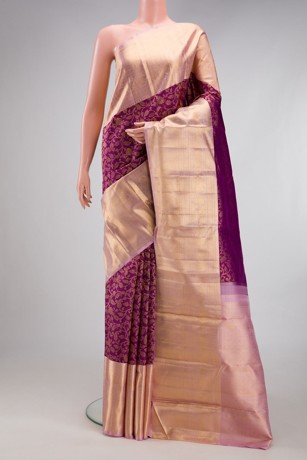 Purple Kanchipuram Silk Saree with Zari Brocade on the body and Zari Border.  displayed on a mannequin
