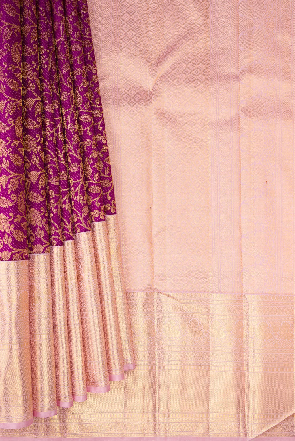Pleats and pallu of Purple Kanchipuram Silk Saree with Zari Brocade on the body and Zari Border. 