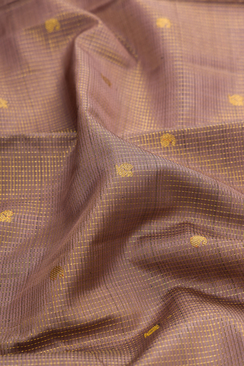 Close up of Pure Silk Brown Dual Tone Kanjivaram Saree with Checked design on the body and Fancy Border.  displaying folds