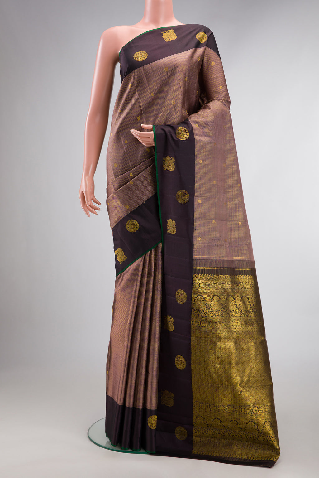 Pure Silk Brown Dual Tone Kanjivaram Saree with Checked design on the body and Fancy Border.  displayed on a mannequin