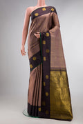 Pure Silk Brown Dual Tone Kanjivaram Saree with Checked design on the body and Fancy Border.  displayed on a mannequin