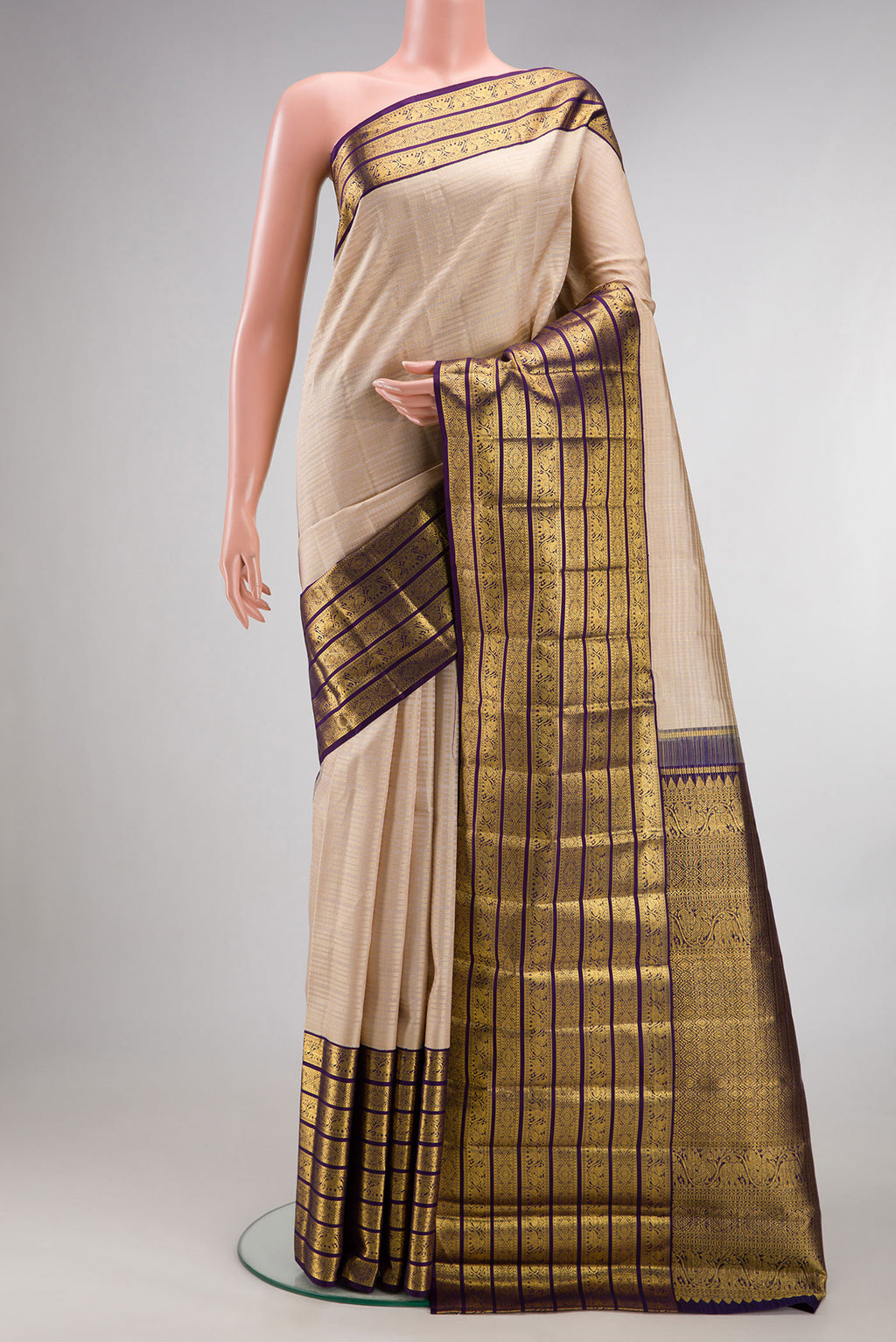 Pure Silk Beige Kanchipuram Saree with Checked design on the body and Zari Border.  displayed on a mannequin