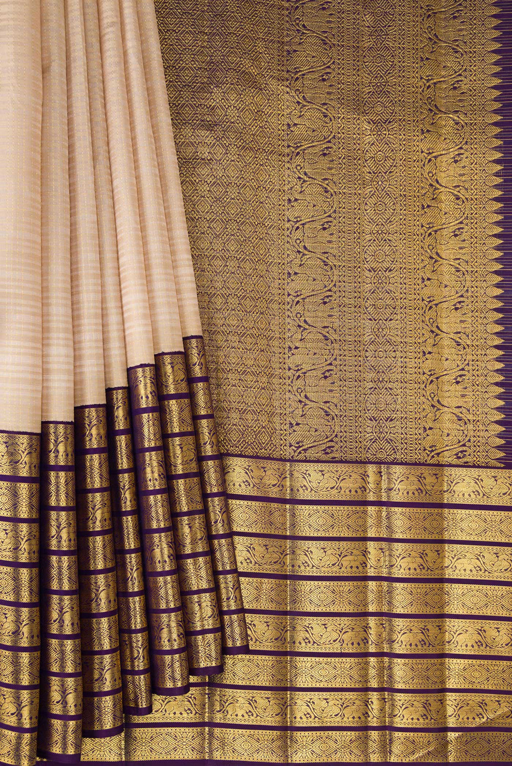 Pleats and pallu of Pure Silk Beige Kanchipuram Saree with Checked design on the body and Zari Border. 