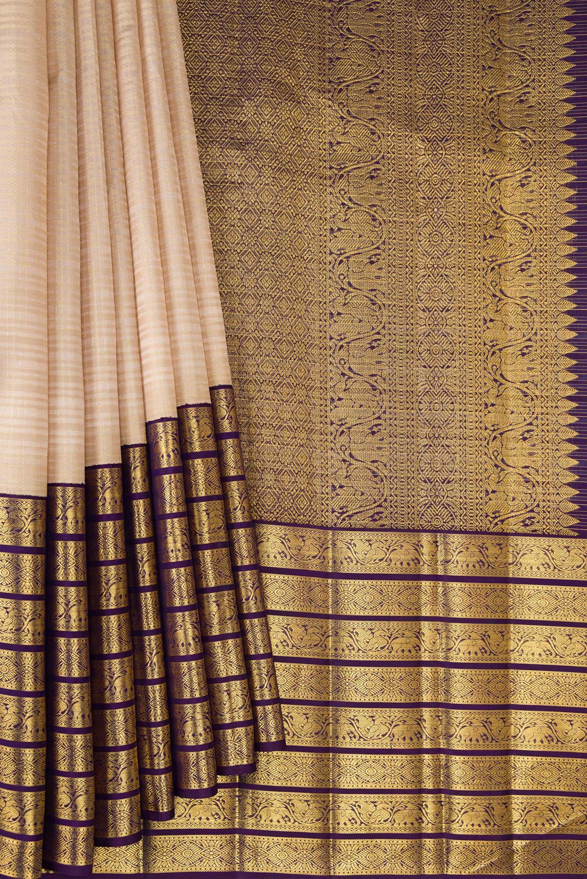 Pleats and pallu of Pure Silk Beige Kanchipuram Saree with Checked design on the body and Zari Border. 