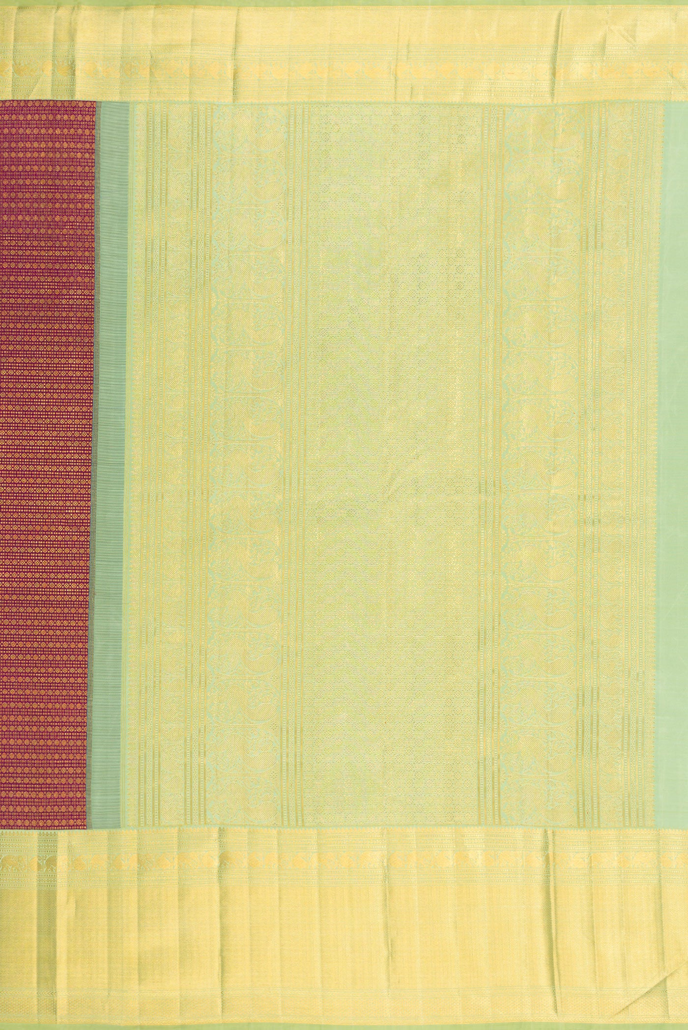Close up image of the pallu of Magenta Kanchipuram Silk Saree with Zari Brocade on the body and Zari Border. 