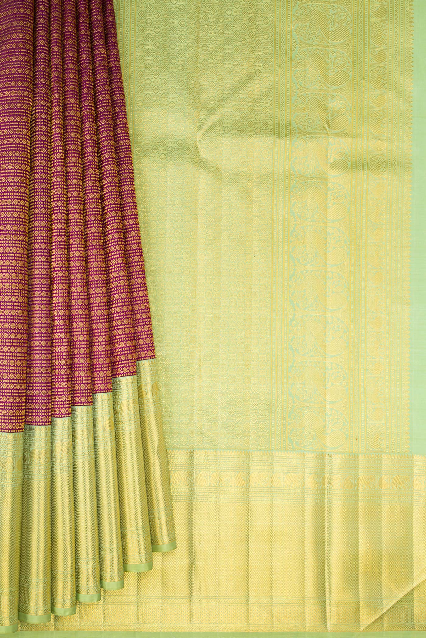 Pleats and pallu of Magenta Kanchipuram Silk Saree with Zari Brocade on the body and Zari Border. 