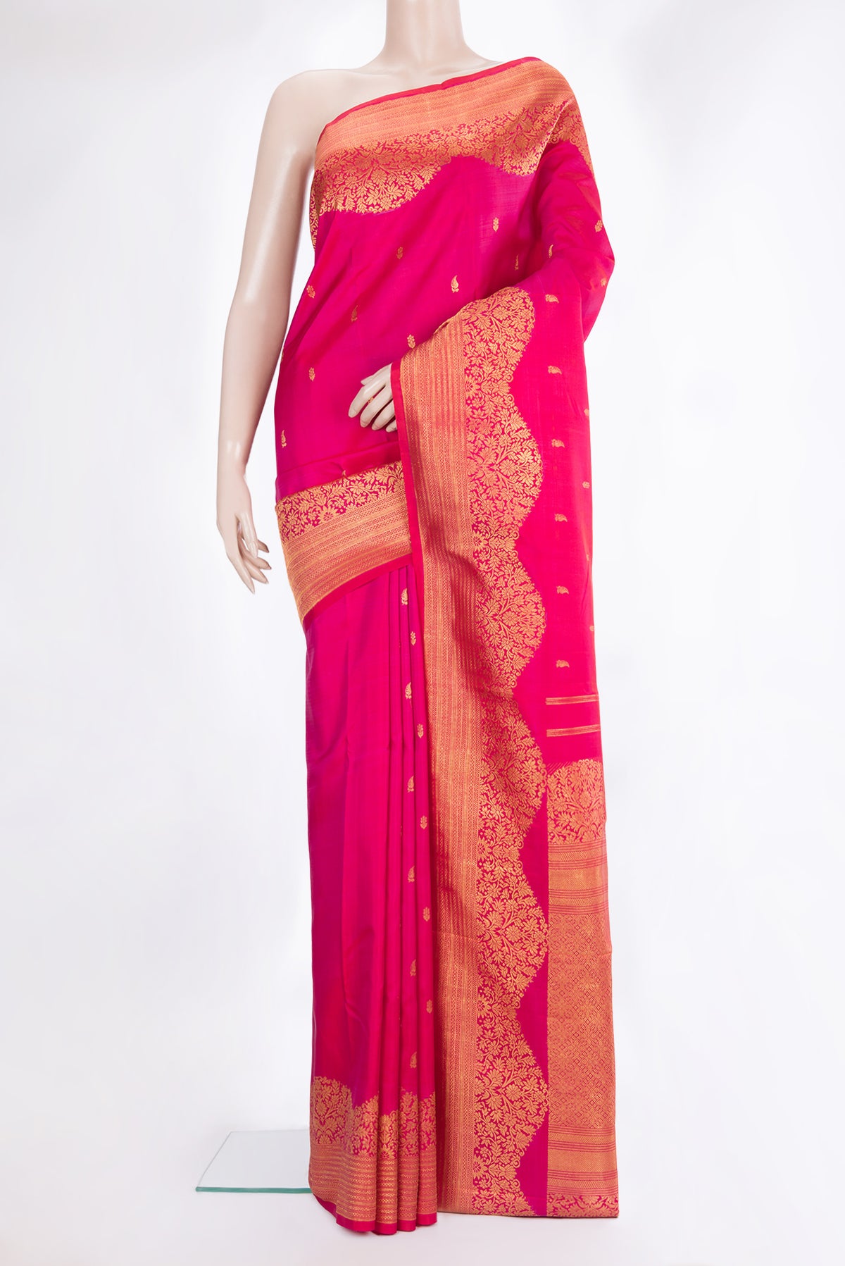 Pure Silk Pink Kanjivaram Saree with Zari Butta on the body and Fancy Border.  displayed on a mannequin