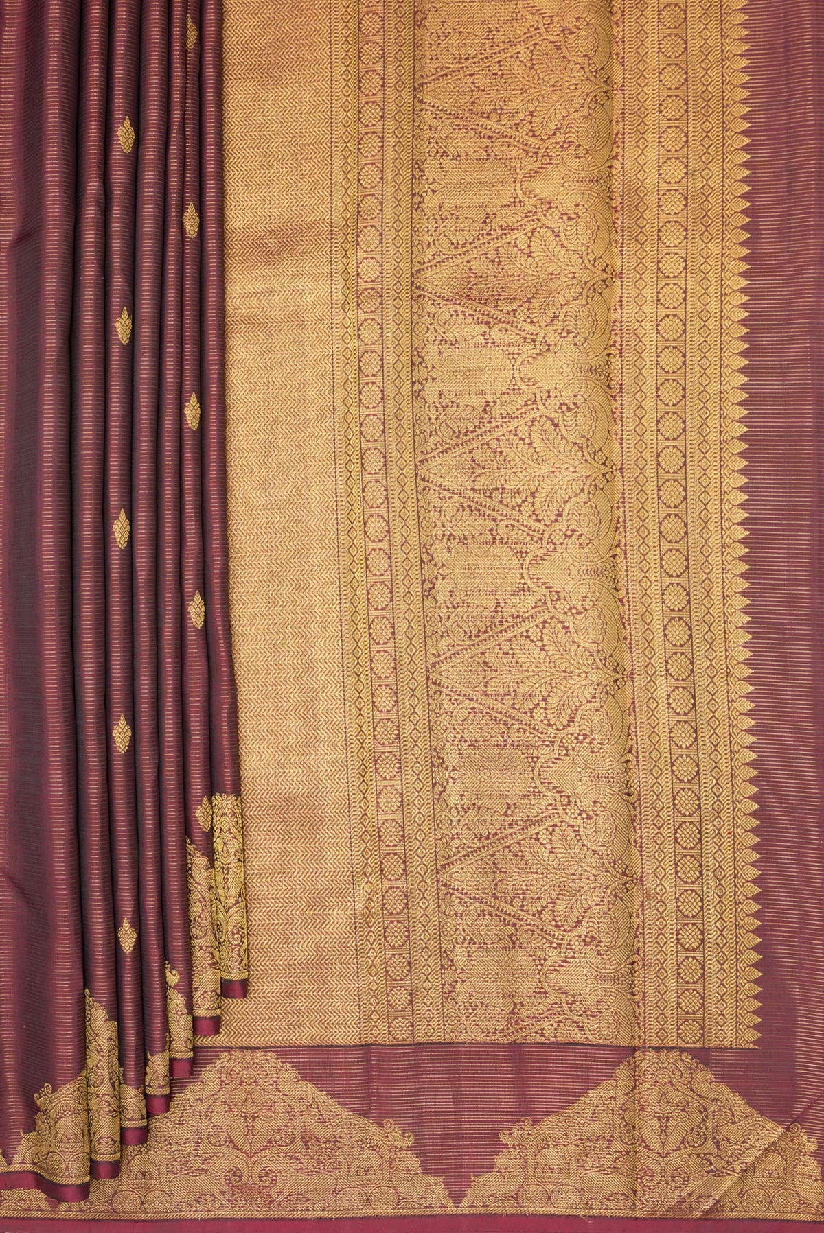 Pleats and pallu of Pure Silk Maroon Kanjivaram Saree with Stripes on the body and Fancy Border. 