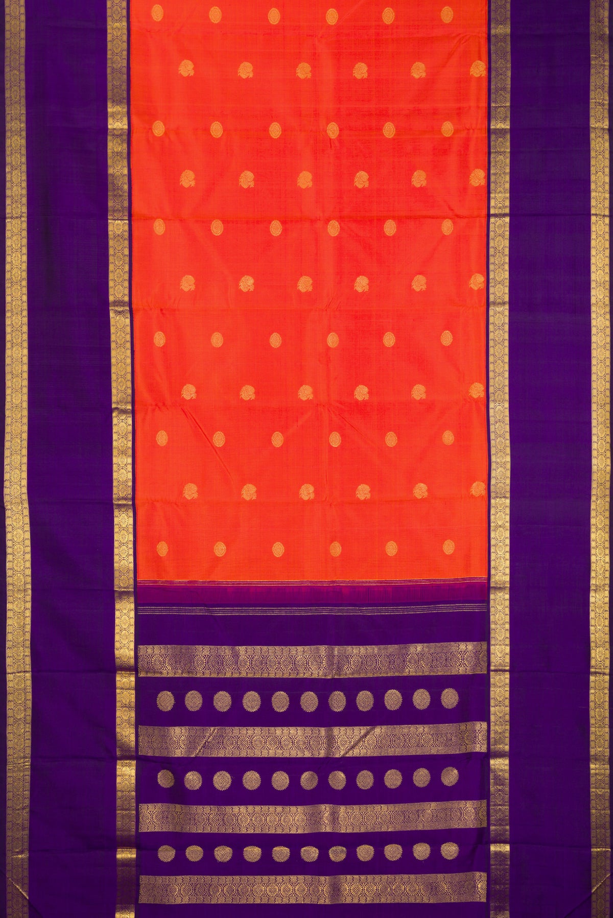Flat view of Pure Silk Pure Zari Brick Orange Dual Tone Kanchipuram Saree with Zari Butta on the body and Zari Border. 