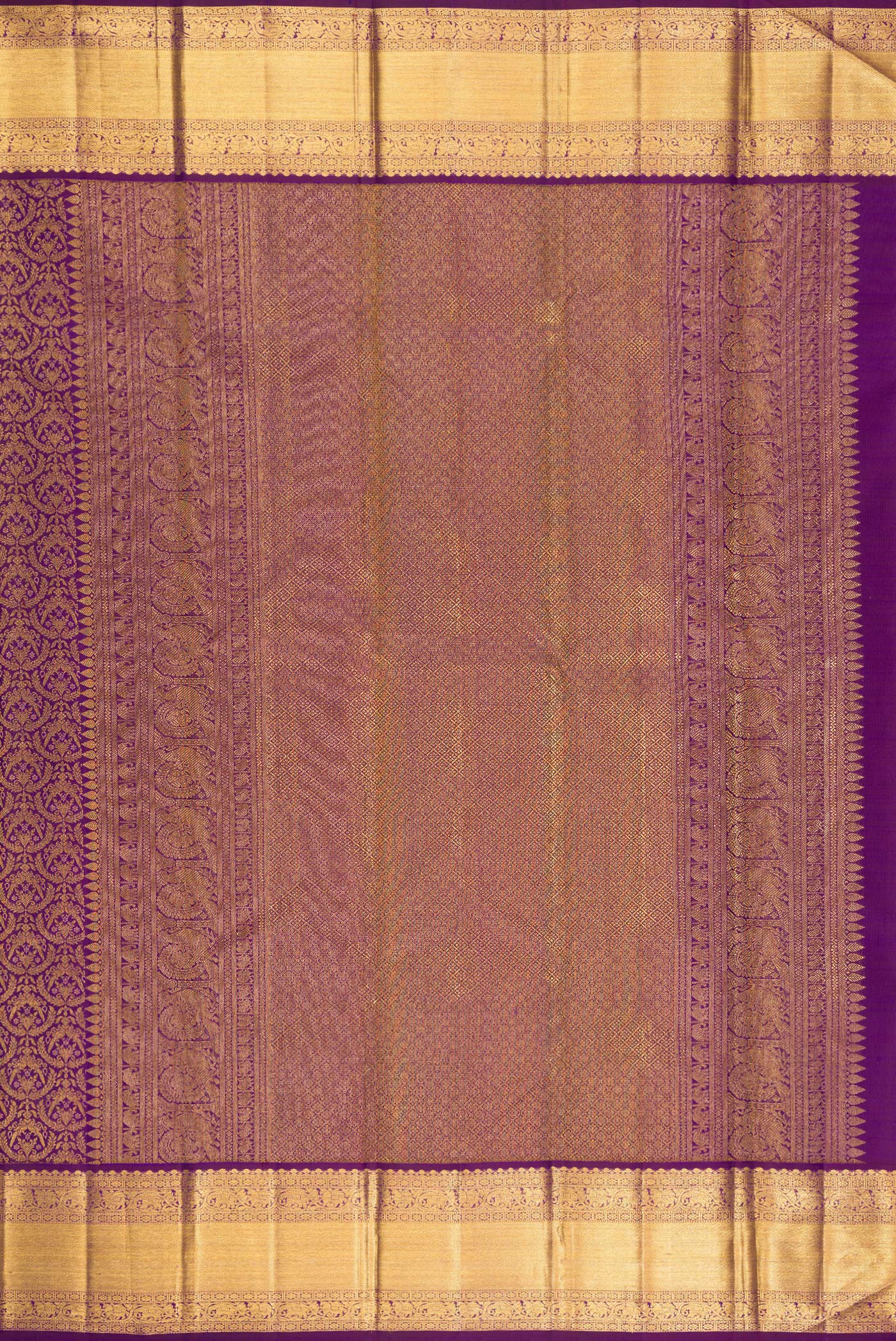 Close up image of the pallu of Purple Kanchipuram Silk Saree with Zari Brocade on the body and Zari Border. 