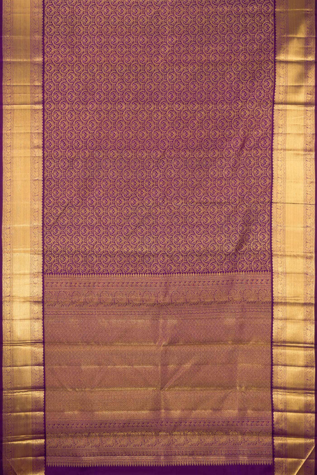 Flat view of Purple Kanchipuram Silk Saree with Zari Brocade on the body and Zari Border. 