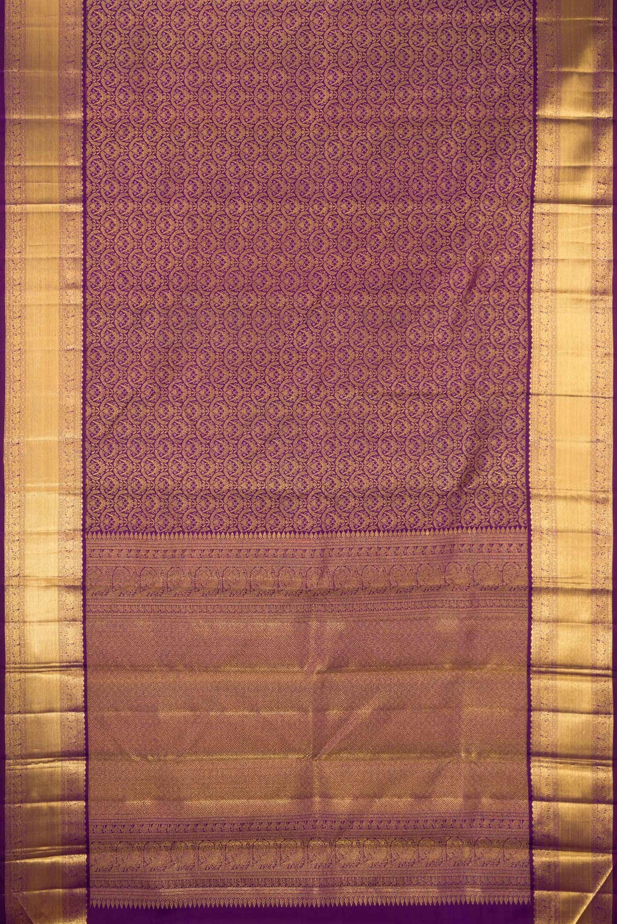 Flat view of Purple Kanchipuram Silk Saree with Zari Brocade on the body and Zari Border. 