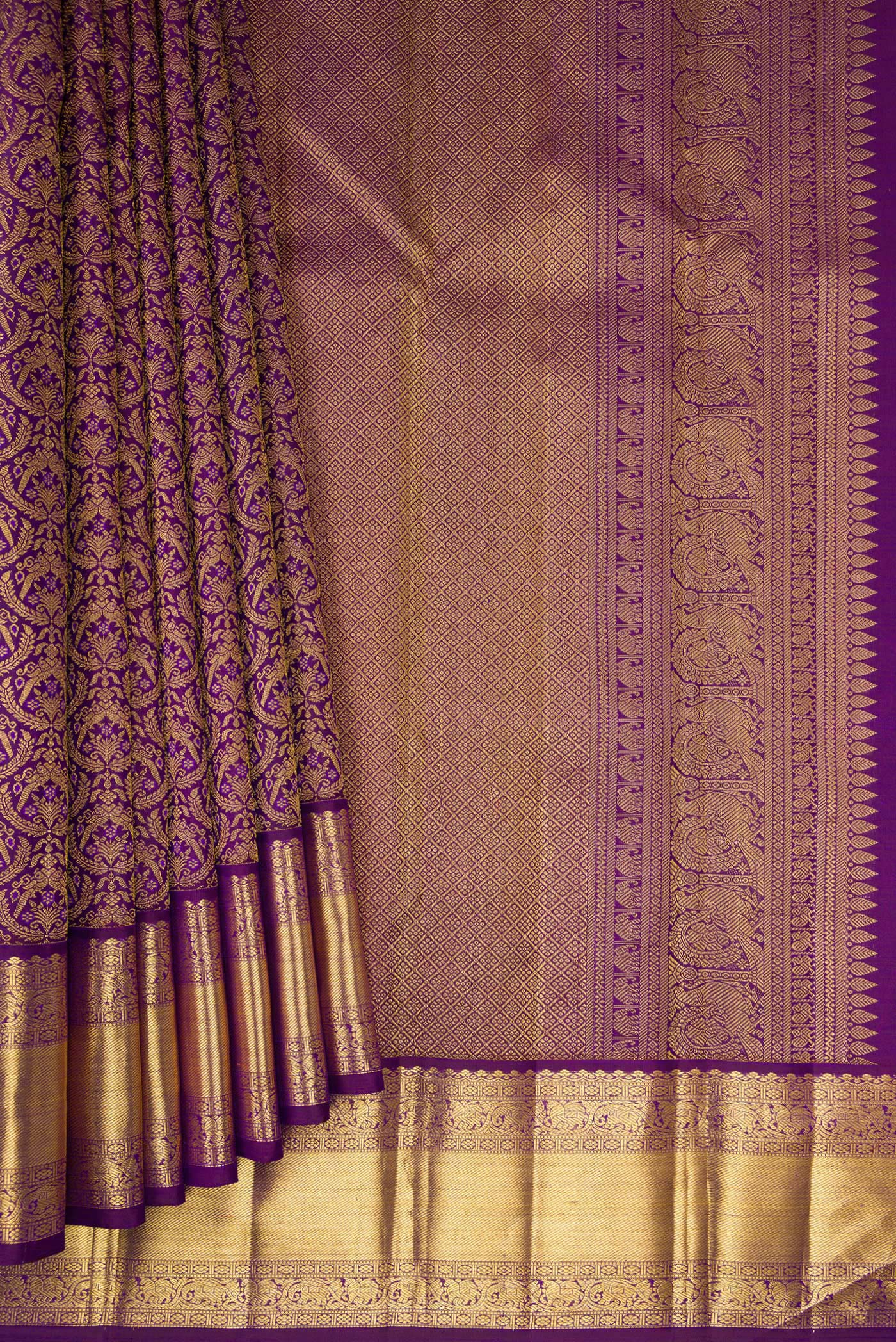 Pleats and pallu of Purple Kanchipuram Silk Saree with Zari Brocade on the body and Zari Border. 