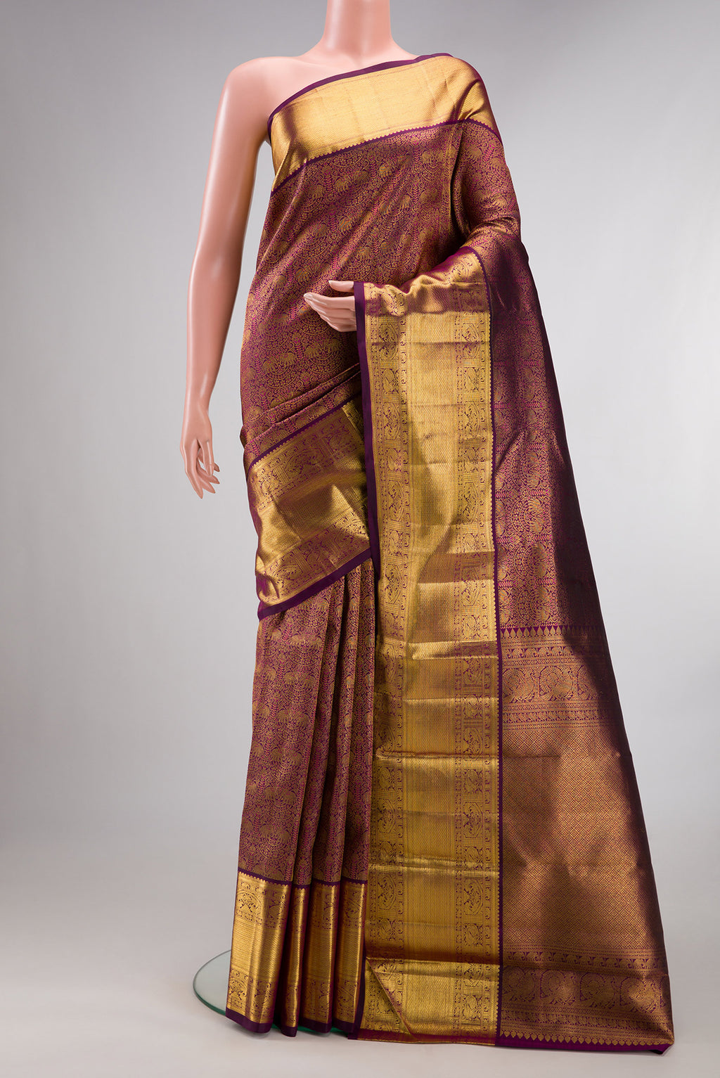 Pure Silk Purple Kanchipuram Saree with Zari Brocade on the body and Zari Border.  displayed on a mannequin