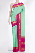 Pure Silk Sea Green Kanjivaram Saree with Plain Body and Zari Border.  displayed on a mannequin
