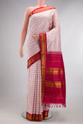 Pure Silk Rose pink Kanjivaram Saree with Veldhari on the body and Zari Border.  displayed on a mannequin