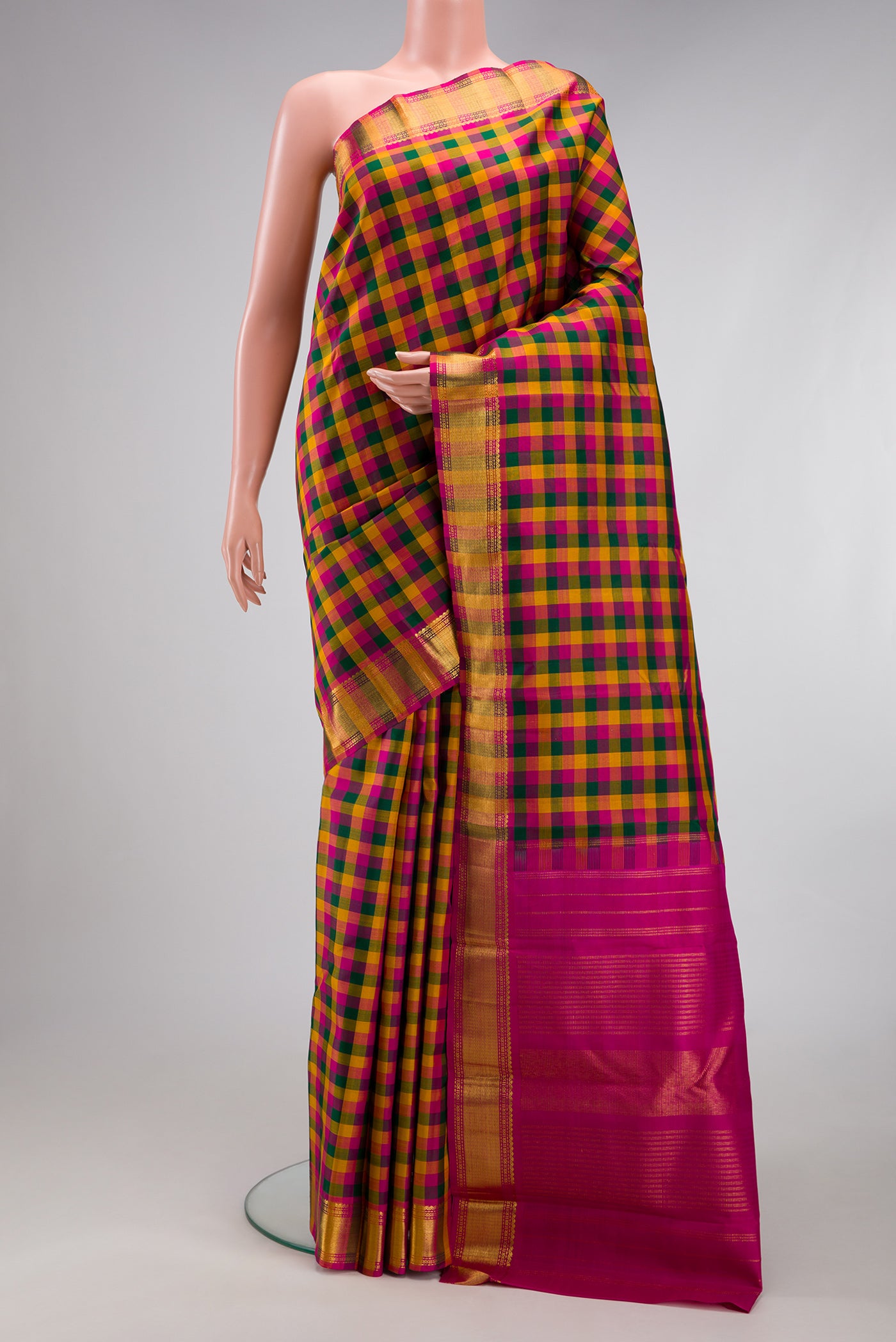 Multi Color Kanchipuram Silk Saree with Checked design on the body and Zari Border.  displayed on a mannequin