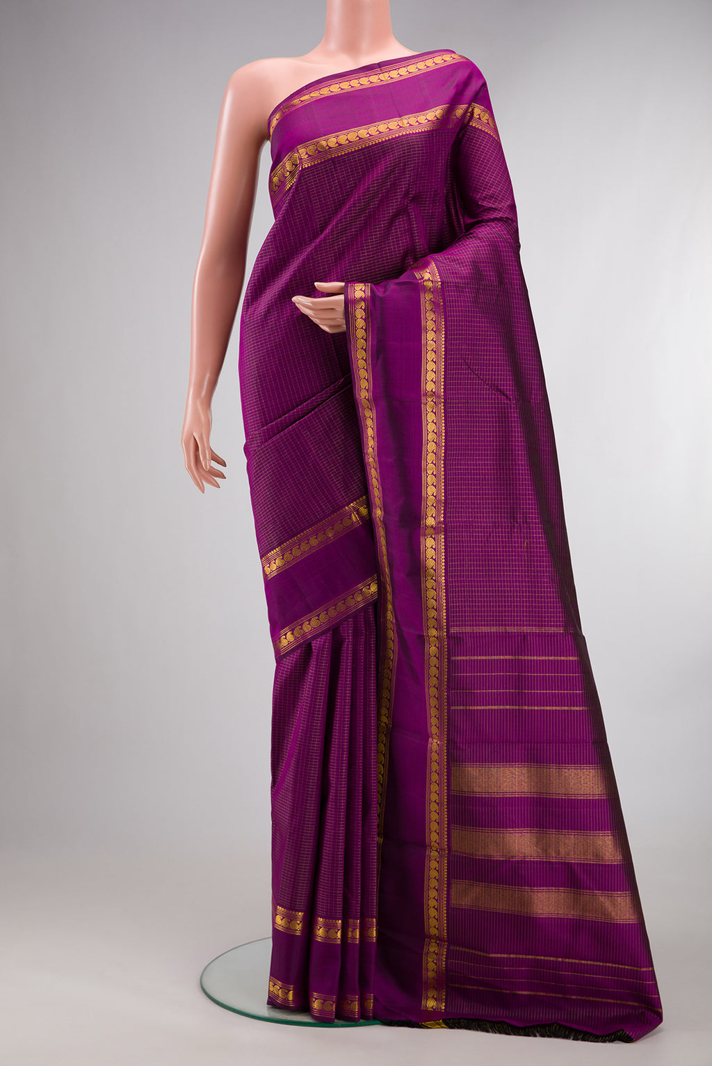 Pure Silk Purple Kanchipuram Saree with Checked design on the body and Zari Border.  displayed on a mannequin