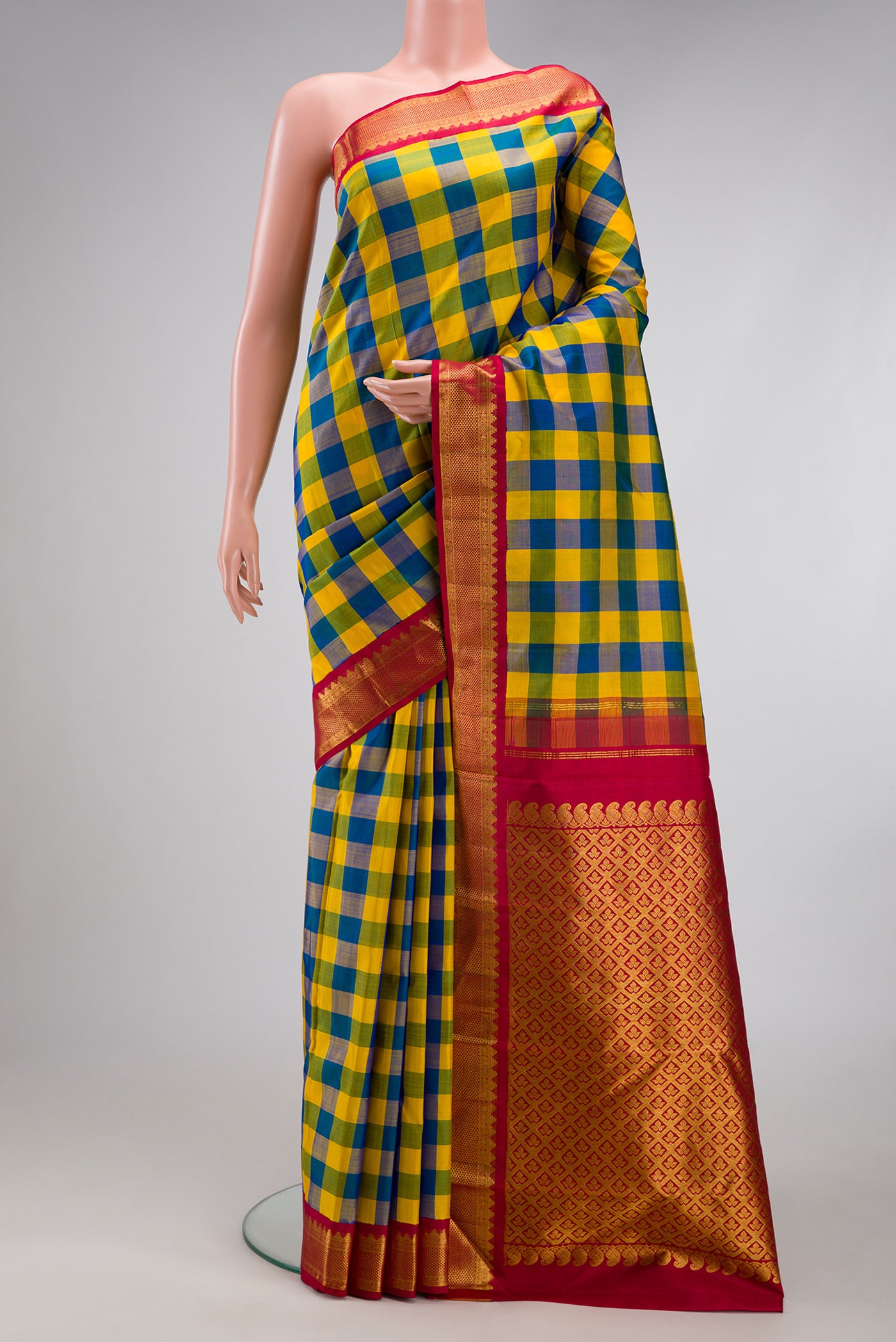 Multi Color Kanjivaram Silk Saree with Checked design on the body and Zari Border.  displayed on a mannequin