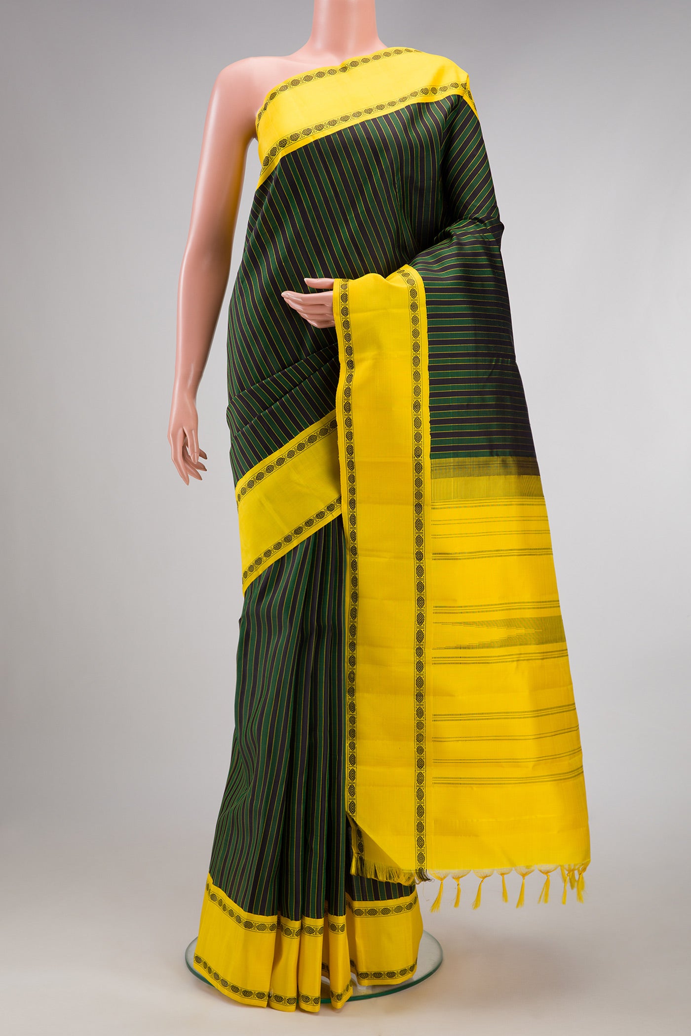 Multi Color Kanjivaram Silk Saree with Stripes on the body and Thread Border.  displayed on a mannequin