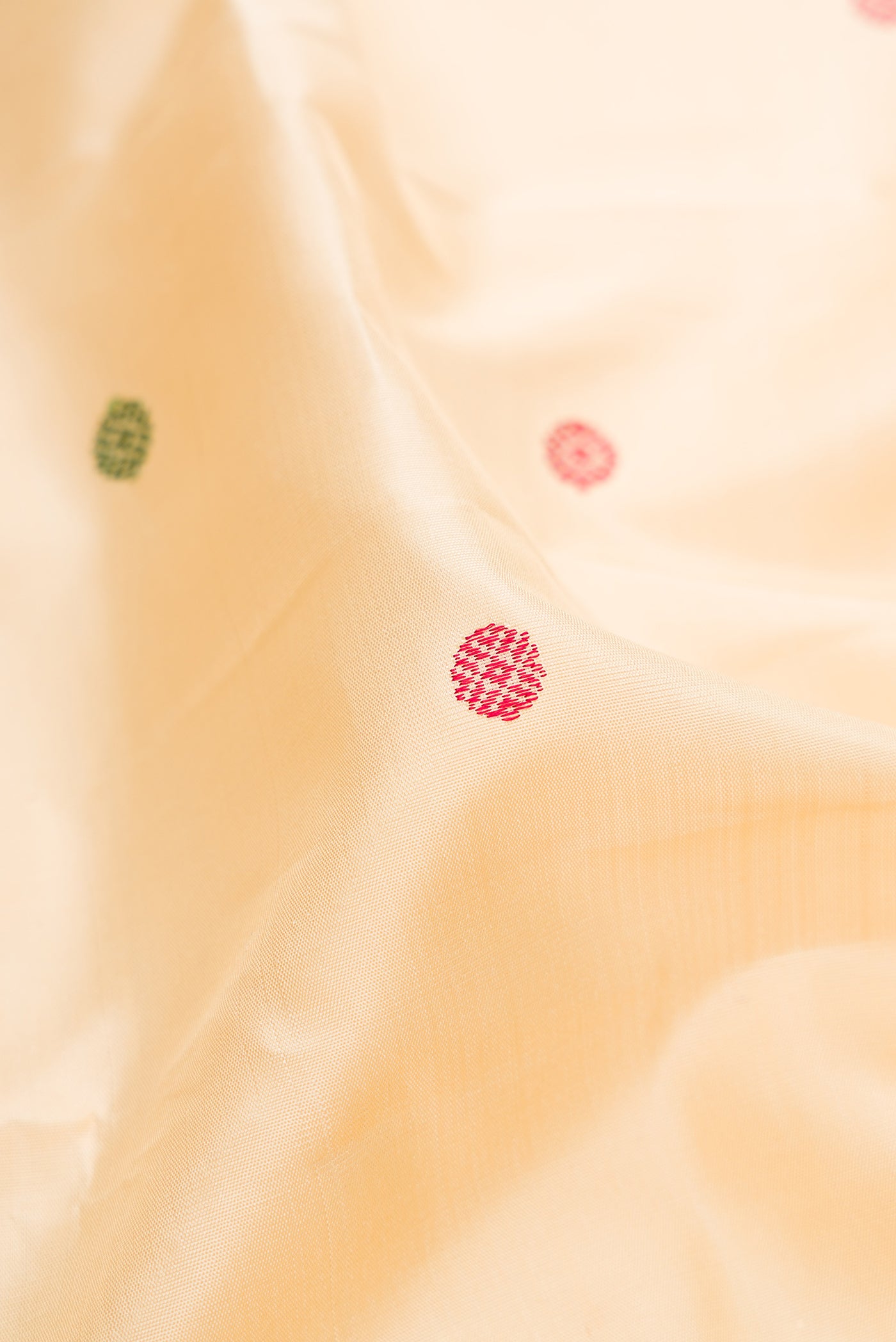 Close up of Sandal Kanjivaram Silk Saree with Thread Butta on the body and Thread Border.  displaying folds