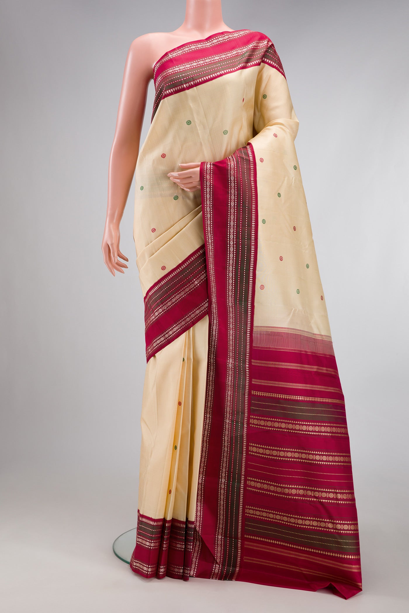Sandal Kanjivaram Silk Saree with Thread Butta on the body and Thread Border.  displayed on a mannequin