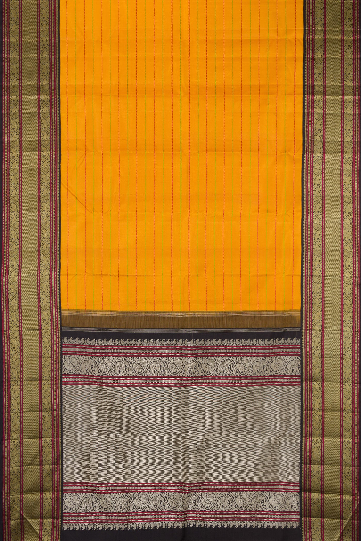 Flat view of Mustard Kanjivaram Silk Saree with Veldhari on the body and Thread Border. 