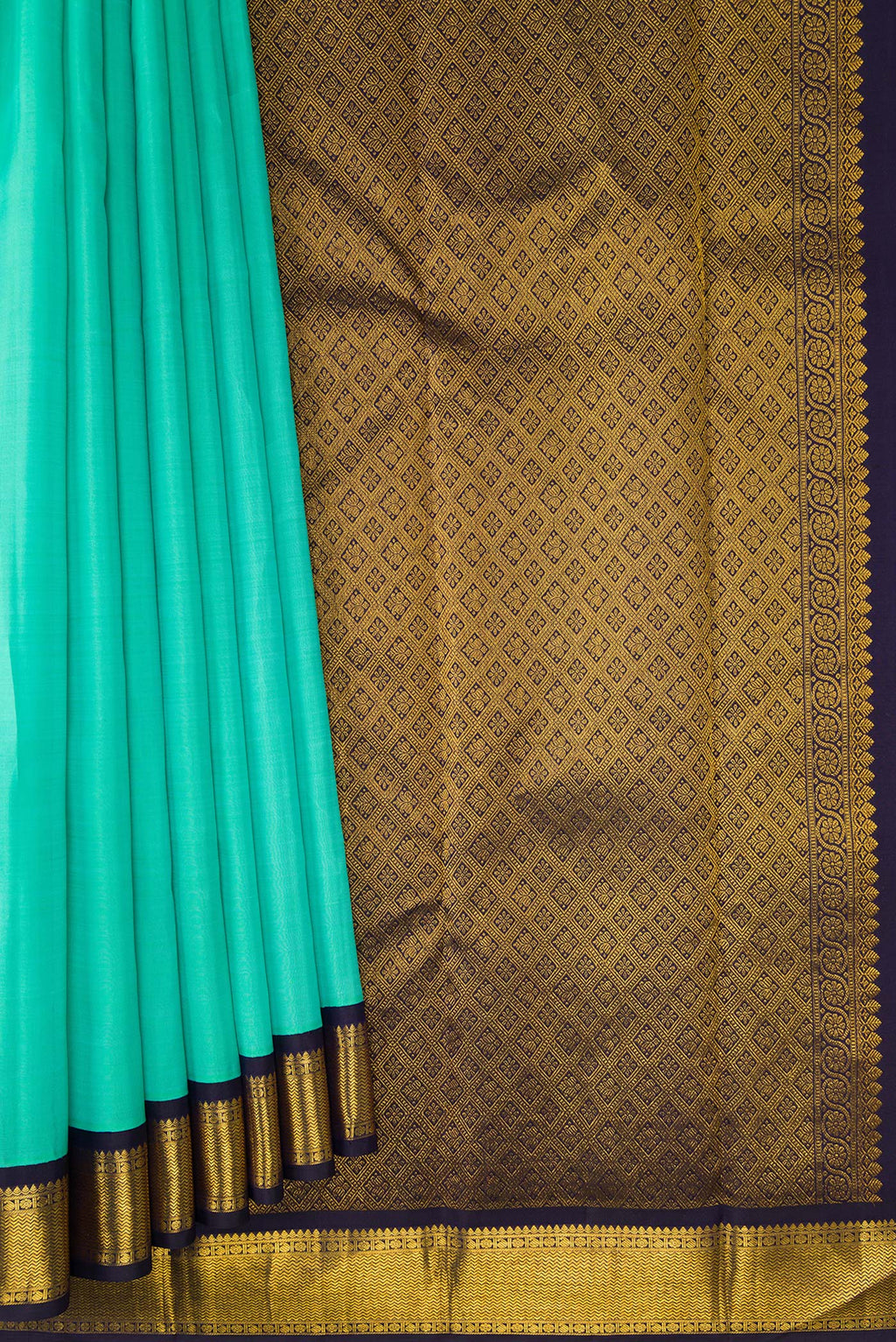 Pleats and pallu of Pure Silk Sea Green Kanjivaram Saree with Plain Body and Zari Border. 